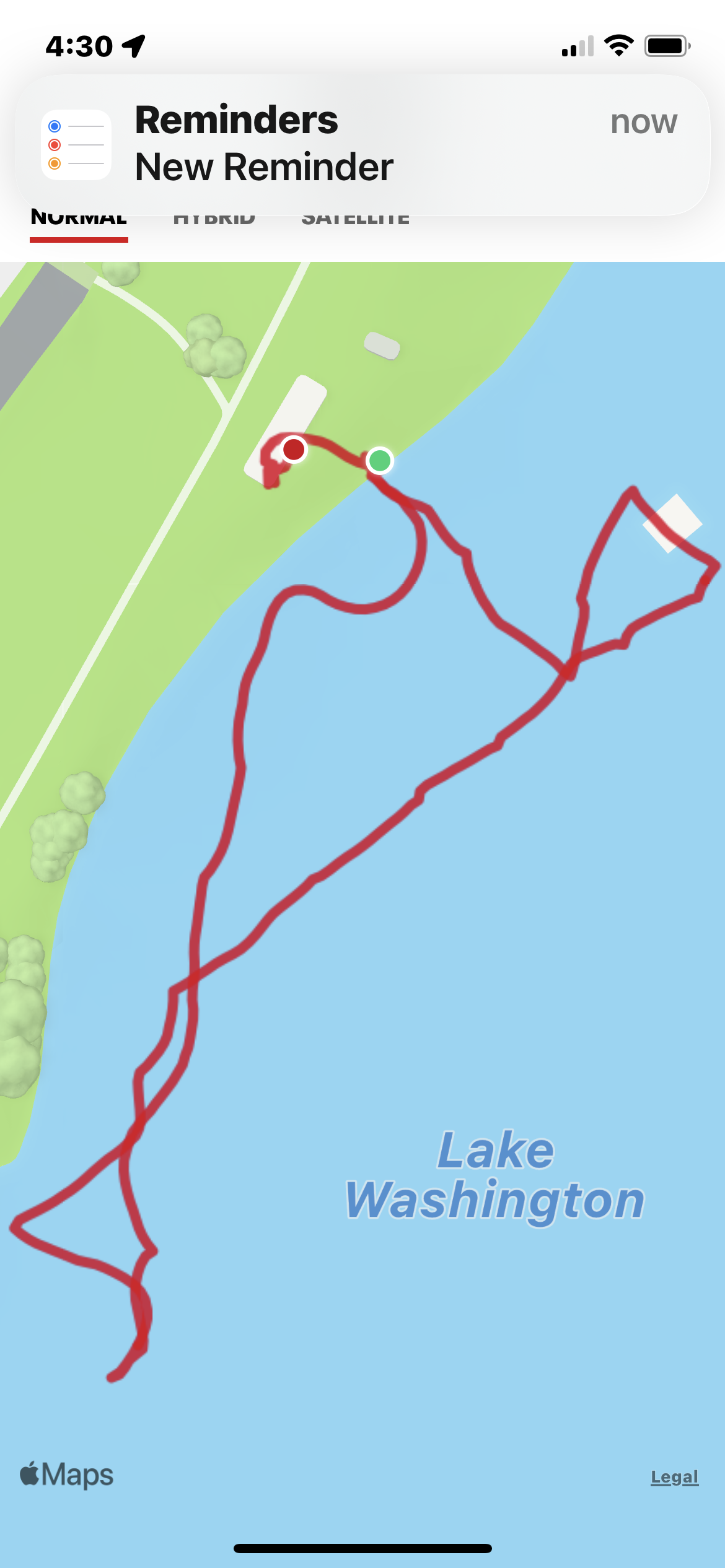 color map of the beach and lake with a red line marking a swim path from GPS tracking